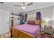 Cozy bedroom with a ceiling fan, natural light and purple accents creating a peaceful retreat at 1653 S Prescott Ave, Clearwater, FL 33756