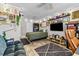 Well-lit bedroom featuring wood floors, an entertainment center, and comfortable furniture at 1653 S Prescott Ave, Clearwater, FL 33756