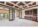 Upstairs entertainment area featuring a wet bar and adjacent living area at 17005 Madres De Avila, Tampa, FL 33613