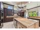 Large kitchen with an island, custom cabinetry, and modern appliances at 17005 Madres De Avila, Tampa, FL 33613