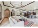 Open living room with tray ceilings and an archway, flowing into the kitchen at 17005 Madres De Avila, Tampa, FL 33613