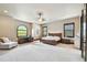 Large main bedroom with furniture, carpet, and multiple windows for natural light at 17005 Madres De Avila, Tampa, FL 33613