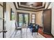 Home office with French doors to pool, custom ceiling and hardwood floors at 17005 Madres De Avila, Tampa, FL 33613