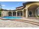 Home exterior with a beautiful pool, covered lanai and manicured landscaping at 17005 Madres De Avila, Tampa, FL 33613