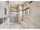 Spacious walk-in shower with multiple shower heads and tiled walls at 17005 Madres De Avila, Tampa, FL 33613