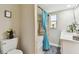 Clean bathroom features toilet, shower/tub combination with curtain, and vanity sink at 1887 Oak Forest E Dr, Clearwater, FL 33759