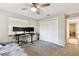 Comfortable bedroom featuring built-in ceiling fan and convenient closet access at 1887 Oak Forest E Dr, Clearwater, FL 33759