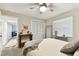This bedroom features a large window, closet, and a stylish console table with decor at 1887 Oak Forest E Dr, Clearwater, FL 33759
