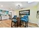 Bright dining area with modern furnishings adjacent to an open kitchen at 1887 Oak Forest E Dr, Clearwater, FL 33759