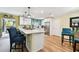 Bright kitchen with stainless steel appliances, white cabinets and island seating at 1887 Oak Forest E Dr, Clearwater, FL 33759