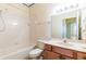Bright full bath featuring vanity, shower, and bathtub combo at 19200 Weymouth Dr, Land O Lakes, FL 34638