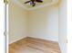 Light filled bedroom with neutral colors, wood floor, and ceiling fan at 19200 Weymouth Dr, Land O Lakes, FL 34638