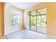 Bright Florida room with tile floors and a view of the screened-in porch at 19200 Weymouth Dr, Land O Lakes, FL 34638