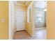 Open foyer featuring tile flooring, a white front door, and views into the living spaces at 19200 Weymouth Dr, Land O Lakes, FL 34638