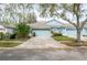 Charming single-story home with a well-manicured lawn and a two-car garage at 19200 Weymouth Dr, Land O Lakes, FL 34638