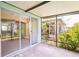 Tiled patio with sliding glass doors that open to the home's interior at 19200 Weymouth Dr, Land O Lakes, FL 34638