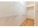 Spacious walk-in closet features multiple shelves for optimal organization at 19200 Weymouth Dr, Land O Lakes, FL 34638