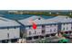 Aerial view of new waterfront construction with a metal roof near a scenic waterway at 19829 Gulf Blvd # 601, Indian Shores, FL 33785