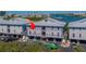 Scenic aerial view of a waterfront construction with a metal roof by a beautiful waterway at 19829 Gulf Blvd # 601, Indian Shores, FL 33785