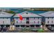 Aerial view of new waterfront construction with a metal roof, situated along a scenic waterway at 19829 Gulf Blvd # 601, Indian Shores, FL 33785