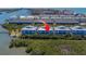 Beautiful aerial view of waterfront condos with water access and lush landscaping at 19829 Gulf Blvd # 601, Indian Shores, FL 33785