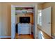 A well-organized closet featuring a dresser with a TV and storage for linens and personal items at 19829 Gulf Blvd # 601, Indian Shores, FL 33785