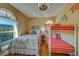 Bright bedroom with a beachy aesthetic with a double bed, a bunk bed and bright natural light at 19829 Gulf Blvd # 601, Indian Shores, FL 33785