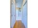 Hallway with storage options and white interior doors and flooring at 19829 Gulf Blvd # 601, Indian Shores, FL 33785