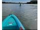 Kayaking on calm waters with a view of distant shoreline and blue sky at 19829 Gulf Blvd # 601, Indian Shores, FL 33785