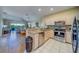 Open kitchen flowing into living and dining areas, stainless appliances, granite countertops at 19829 Gulf Blvd # 601, Indian Shores, FL 33785