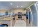 Well-lit kitchen boasts stainless appliances, granite countertops, and ample cabinet space at 19829 Gulf Blvd # 601, Indian Shores, FL 33785
