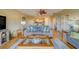 Comfortable living room with neutral color scheme and view of the kitchen and dining area at 19829 Gulf Blvd # 601, Indian Shores, FL 33785