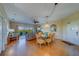 A spacious open living area with views, dining set, and sliding door access to the balcony at 19829 Gulf Blvd # 601, Indian Shores, FL 33785