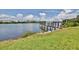 Enjoy scenic water views from the grassy lawn near the private dock at 19829 Gulf Blvd # 601, Indian Shores, FL 33785