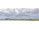 Distant view of a waterfront community with a wide open cloudy sky at 19829 Gulf Blvd # 601, Indian Shores, FL 33785