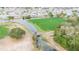 Aerial perspective of a green area, waterways, and residential area with a bridge in the distance at 2007 E View Dr, Sun City Center, FL 33573