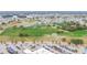 Panoramic aerial shot of the community, featuring lush greenery, ponds, and residential areas at 2007 E View Dr, Sun City Center, FL 33573