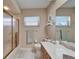 Bathroom featuring tile floors, shower, and long vanity at 2007 E View Dr, Sun City Center, FL 33573