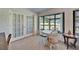 Cozy breakfast nook featuring a white table set and bright view through large glass windows at 2007 E View Dr, Sun City Center, FL 33573
