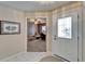 Bright foyer featuring tile flooring, a decorative front door, and a view into the adjacent living space at 2007 E View Dr, Sun City Center, FL 33573