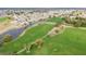 Overhead shot showcasing the lush green golf course with water features and residential area in the background at 2007 E View Dr, Sun City Center, FL 33573
