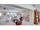 Spacious living area with high ceilings, comfortable seating, and ample natural light at 2007 E View Dr, Sun City Center, FL 33573