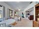 Open-concept living area with a sunroom, comfortable seating, and a bright, airy feel at 2007 E View Dr, Sun City Center, FL 33573