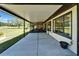 Spacious covered patio with views of the landscaped backyard and golf course at 2007 E View Dr, Sun City Center, FL 33573