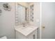 Bright bathroom vanity with decorative mirror and white countertop at 2254 Sequoia Dr, Clearwater, FL 33763