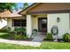 Inviting front porch of a home with a decorative door, tiled entrance, and well-manicured landscaping at 2254 Sequoia Dr, Clearwater, FL 33763
