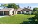 Charming single-story home with a well-manicured lawn and attached two-car garage, exuding curb appeal at 2254 Sequoia Dr, Clearwater, FL 33763