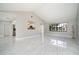 Bright and spacious living room featuring sleek tile flooring, high ceilings, and ample natural light at 2254 Sequoia Dr, Clearwater, FL 33763