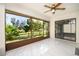 This sun room features tile flooring and large sliding glass doors that look out into the landscaped yard at 2254 Sequoia Dr, Clearwater, FL 33763