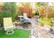 Serene backyard with stone pathway, lush foliage, and inviting lounge area at 2501 Emerson S Ave, St Petersburg, FL 33712